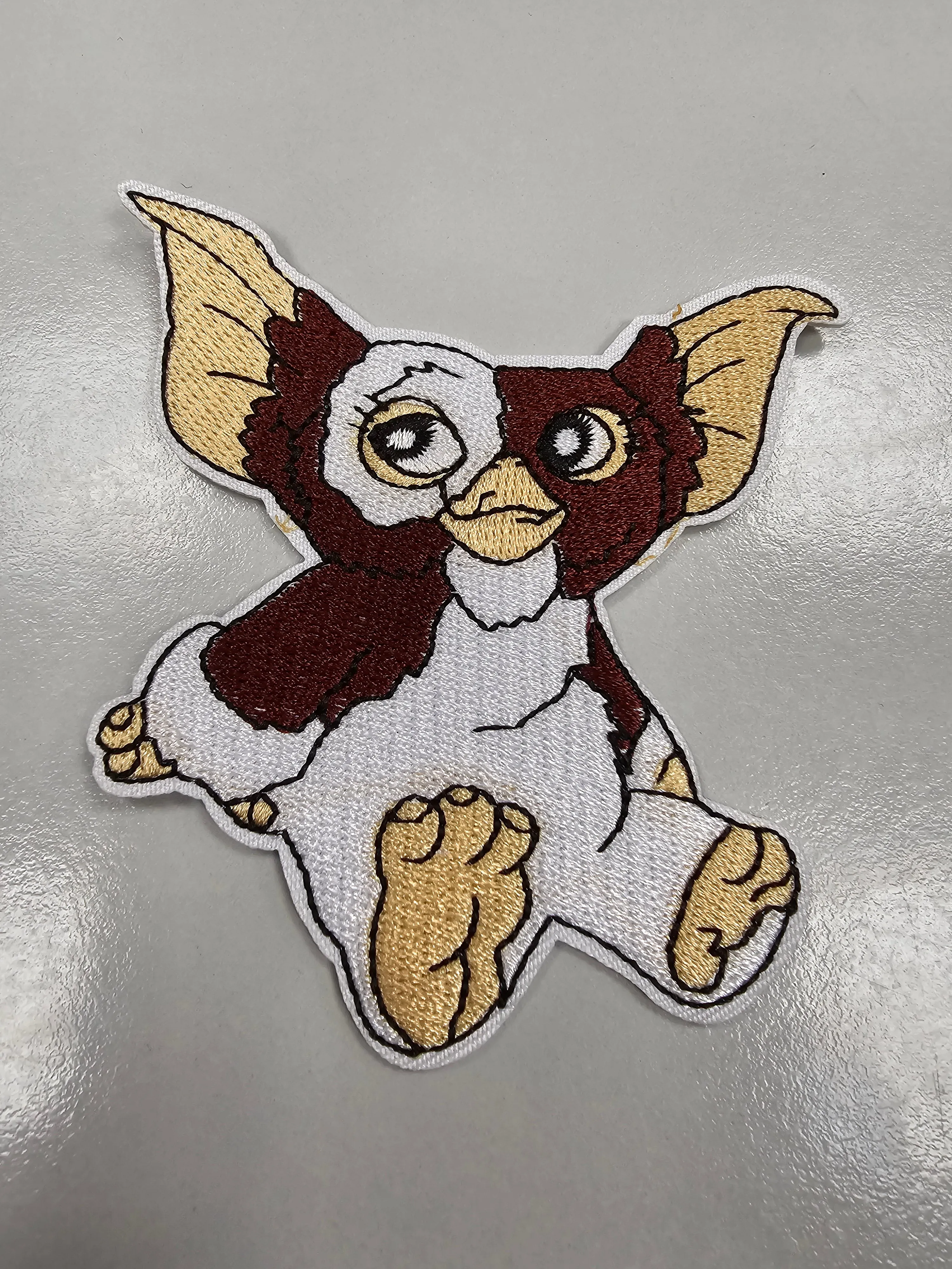 Patches - Gizmo sitting